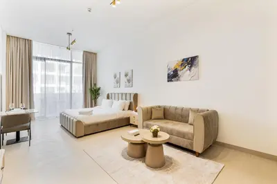 a living room with a bed and a couch at ALiving Cozy Studio I Binghatti Galaxy, JVC- G02 in Dubai