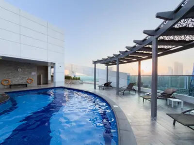 a large swimming pool on the top of a building at Escape24 Elegant 1BR with City View near Dubai Mall in Dubai