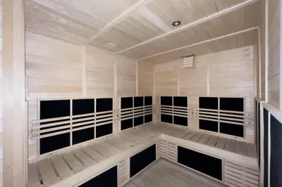 a sauna with black and white panels in a room at GuestReady - 1BR l Burj Khalifa & Canal Views in Dubai