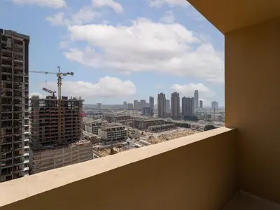 a view of a city from the balcony of a building at Glamorous Luxe Studio in Ghalia-JVC-12 in Dubai