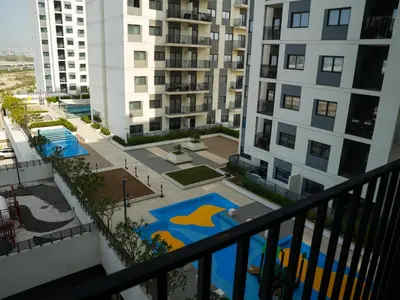 a view from the balcony of a apartment building at 2BR Next to Metro and EXPO City GYM Pool Playground in Dubai