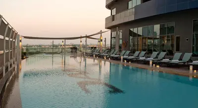 a swimming pool on the side of a building at Damac Maison Mall Street! Upgraded 3 Bedroom with Burj and DIFC views! Nearest to Dubai Mall in Dubai