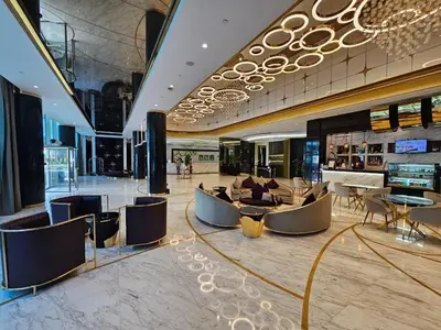 a lobby with couches and tables in a building at Sunrise Homes A Beautiful Studio in Downtown in Dubai