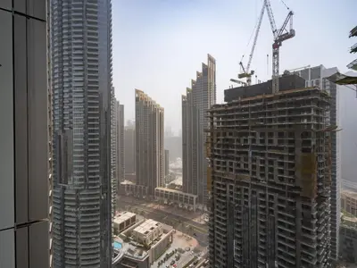 a view of a city with tall buildings at Grande Essence Elegant 1BR Sleeps 4 in Downtown in Dubai
