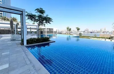 a large swimming pool on top of a building at Creek Harbour Gem Stylish 2BR with Stunning Views-17 in Dubai