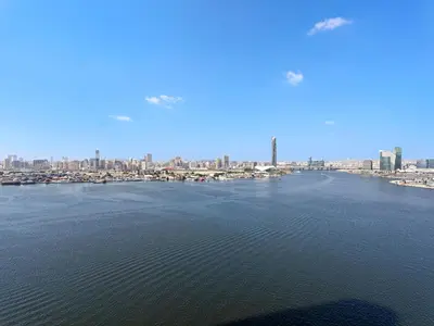 an aerial view of a large body of water with a city at Creek Harbour Gem Stylish 2BR with Stunning Views-17 in Dubai