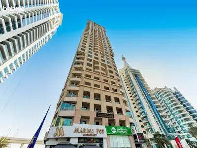a tall building in the middle of two tall buildings at bnbmehomes - Manchester Tower in Dubai