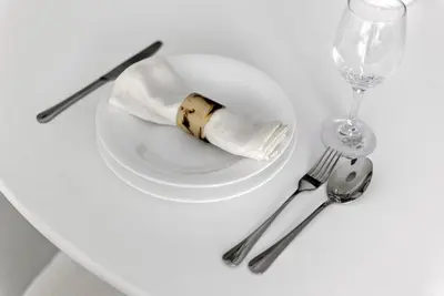 a white plate with a piece of food on a table at 2BR plus M CF7 B Partial Canal View in Dubai