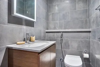 a bathroom with a toilet and a sink at STAY BY LATINEM Luxury 1BR Holiday Home CB 0618 Near Burj Khalifa in Dubai