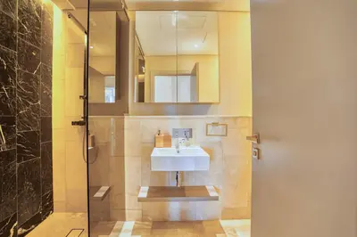 a bathroom with a sink and a shower at PVH - The 8 - Opulent 3BR with Sea View and Private Beach Access in Dubai