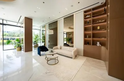 a living room with a couch and a table at Sleeps 4 I Circle Mall I Epic Pool in Dubai
