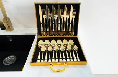 a set of forks and knives in a wooden box at Private Pool I Sleeps 6 I 5 Star Amenities I 2BR Onyx in Dubai