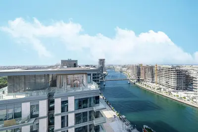 a view of a river from a building at Canal Front Luxe, Elegant 2BR with Water Views in Dubai