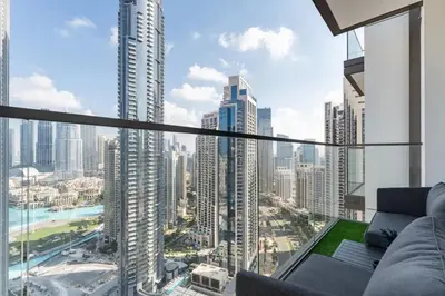 a living room with a view of a city at 3Min to Dubai mall and Burj Khalifa, Luxury 1B and Amenities in Dubai