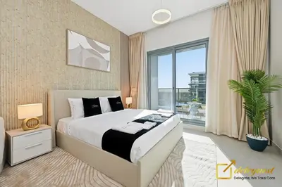 a bedroom with a large bed and a large window at Oversized 1BR Apartment Near Dubai Hills Mall in Dubai