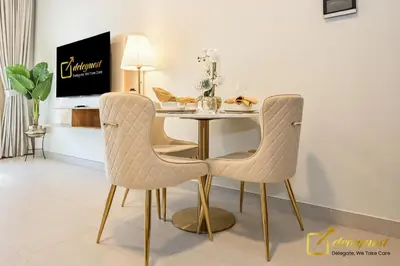 a dining room with a table and two chairs at Elite Studio in Dubai Hills Near Dubai Hills Mall in Dubai