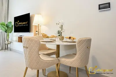 a dining room with a table and chairs at Elite Studio in Dubai Hills Near Dubai Hills Mall in Dubai