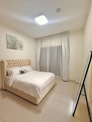 a bedroom with a large bed and a window at Flat 1BR Business Bay the bay in Dubai
