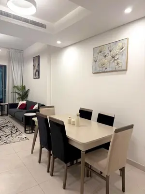 a dining room with a table and chairs at Flat 1BR Business Bay the bay in Dubai