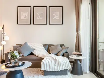 a living room with a couch and two tables at Luxury Stunning Burj Khalifa View High Floor Big Balcony Pool&Gym 1BR 80m2 in Dubai