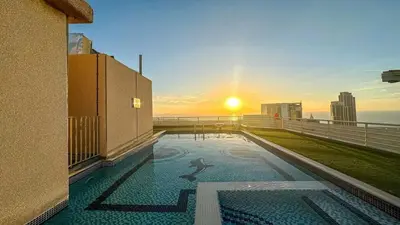 a view of the sunset from the balcony of a building at Lux 3 Bedroom Apt In Dubai Marina Man 2003 in Dubai
