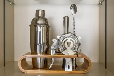 a shelf with a blender and other kitchen utensils at New Elegant 1BR with Balcony & Pool in Park Field in Dubai