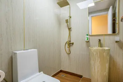 a bathroom with a white toilet and a shower at Luxury 2BHK in Dubai Marina Escan 2001 in Dubai
