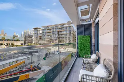 a balcony with a view of a city at Daniels 1BR at Viridian by Central Park, City Walk in Dubai