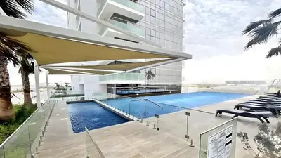 a swimming pool on the side of a building at Studio in Dubai