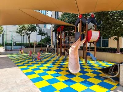 a playground with a slide on a checkered floor at New 1BR Burj View Infinity Pool 5min Dubai mall in Dubai