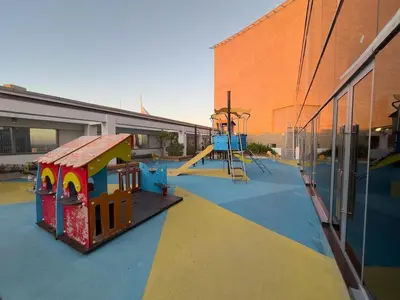 a playground with a slide and a play equipment at Sky Gardens By Luxe Living Collection - Duplex 2BR - DIFC in Dubai