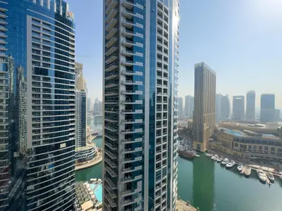 a view of a city with tall buildings and a river at Werova- Waterfront 1-Bedroom Apartment Furnished in Dubai
