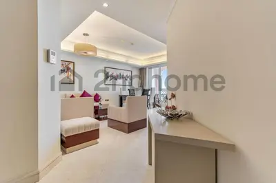 a room with a living room and a bedroom at Beachfront Escape Sea-View Balcony Palm Jumeirah in Dubai