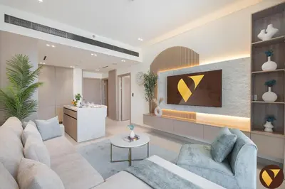 a living room with a couch and a table at Vogue JVC Binghatti Phoenix near Circle Mall, One Bedroom Apartment with Balcony and Access to all Amenities in Dubai