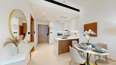 a kitchen and dining room with a table and chairs at Vacationer l Elegant 1 Bedroom l Near to Park and Mall l JVC in Dubai