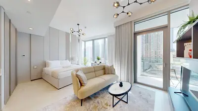 a living room with a couch and a bed at Vacationer l Chic Upgraded Studio l City Views l Dubai Marina in Dubai