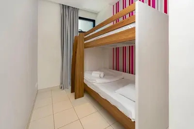 a small room with two bunk beds in it at Stylish 2BR with Maids Room City Walk in Dubai