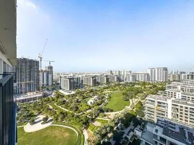 an aerial view of a city with tall buildings at Superhost - 1BR Apartment, Balcony, Pool & Gym , Dubai Hills in Dubai