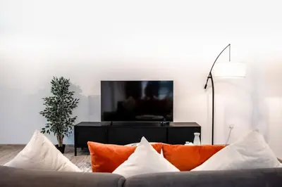 a living room with a couch and a tv at Sulafa Tower, Dubai Marina - Onelink in Dubai