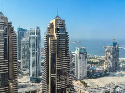 a view of a large city with tall buildings at Cayan Tower, Dubai Marina - Onelink in Dubai