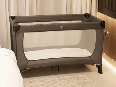 a black bunk bed in the corner of a room at Peninsula One Suites by Prestige Nest in Dubai