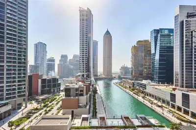 a view of a river in a city with tall buildings at Frank Porter - Peninsula One in Dubai