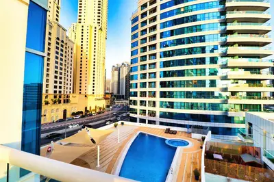 a view from the balcony of a building with a swimming pool at Barsana - Aurelia by JBR Beach - 2 Bed - Marina Views! in Dubai