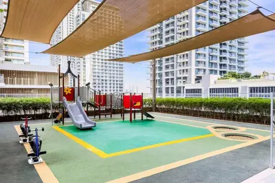 a playground in a building with a slide at Beachfront 1BR Retreat Beach Isle Tower 01 in Dubai