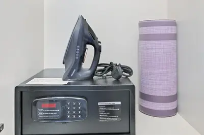 a black phone sitting on top of a microwave at Bloomfields STU in Business Bay, Bayz by Danube in Dubai