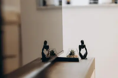 a couple of figurines sitting on a counter at Dubai Marina - 1BHK Cozy Vacation Homes near Metro in Dubai
