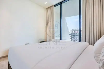 a white room with a large glass window at Binghatti Royale premium 1BR with Jacuzzi in Dubai