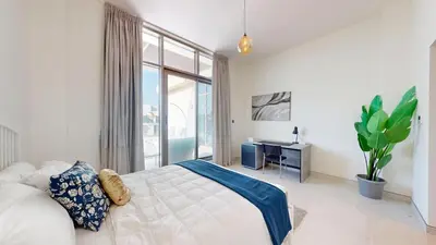 a bedroom with a bed and a large window at Luxury 2br Penthouse Spacious in Dubai