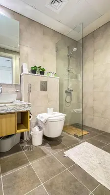 a bathroom with a shower and a toilet and a sink at High floor studio with stunning views in Aykon City in Dubai