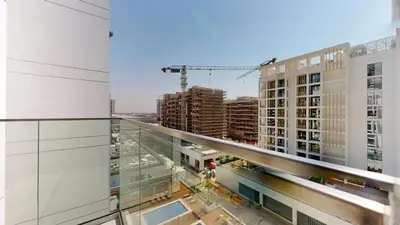 a view from the balcony of a building under construction at Modern Furnished Studio Azizi Riviera in Dubai